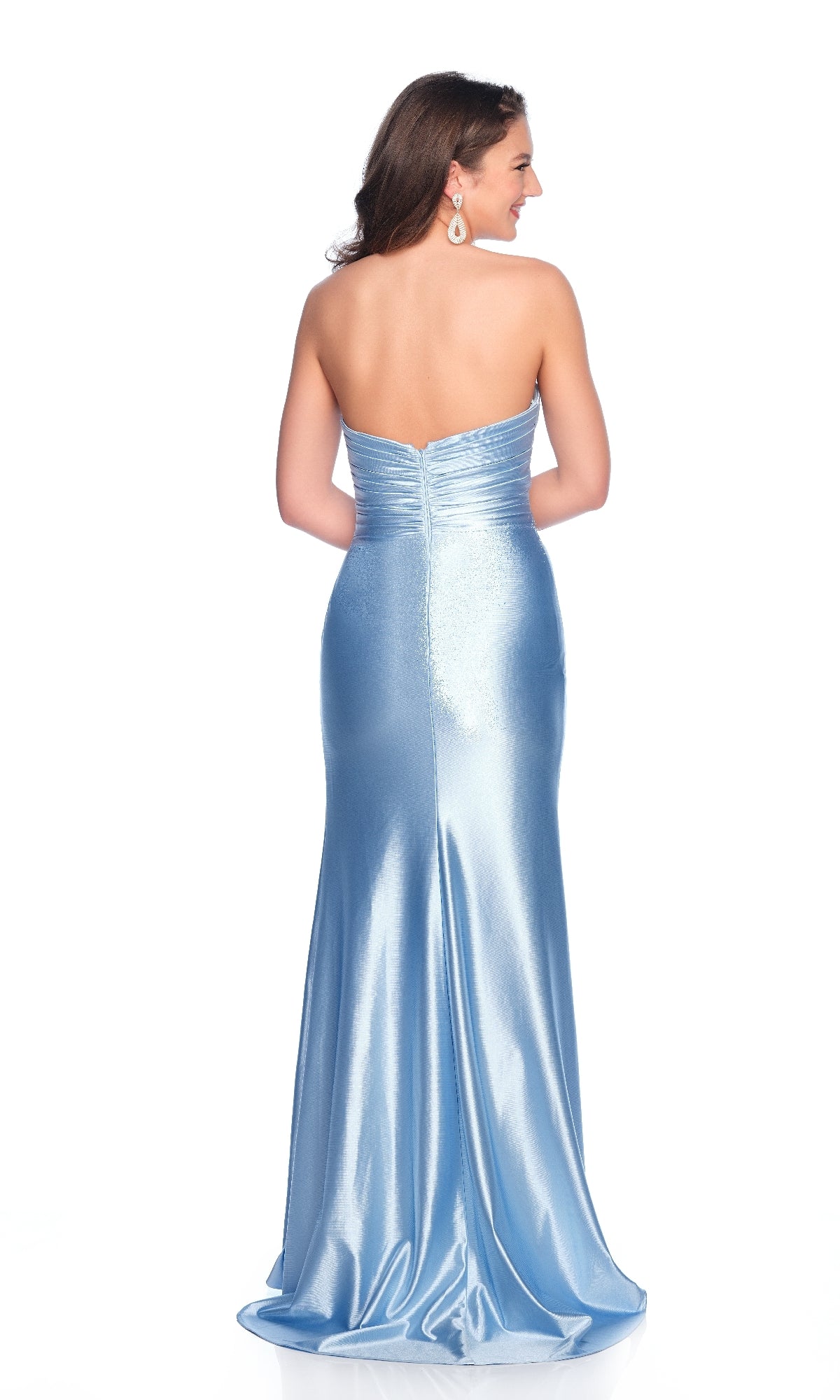 A woman with wavy, shoulder-length hair faces away, showcasing the fitted back of her floor-length Blue Strapless Prom Dress: Dave & Johnny 12149 with a sweetheart neckline and light blue satin fabric.